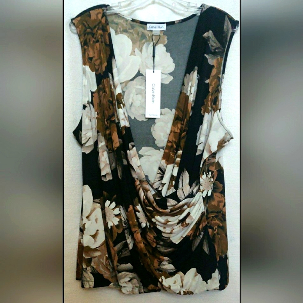 Calvin Klein top. Floral print, sleeveless, plunge V-neck, faux wrap style. S 2X